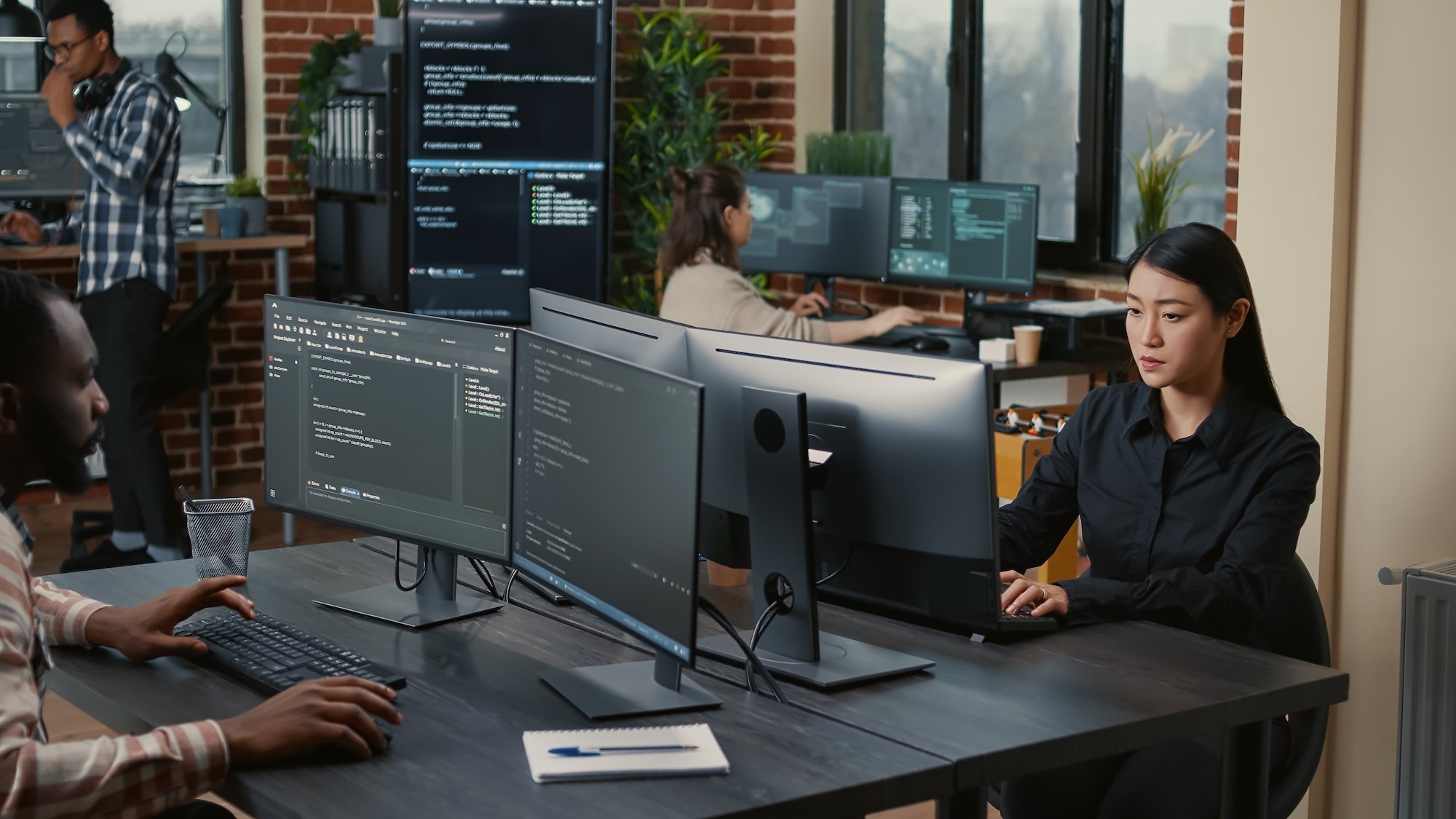 woman working behind computer